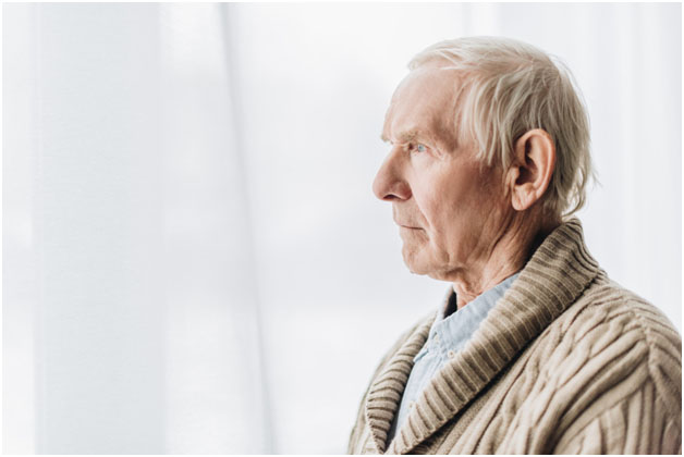 Defining Dementia Aravilla Clearwater Memory Care Blog - Senior Staring off into the distance