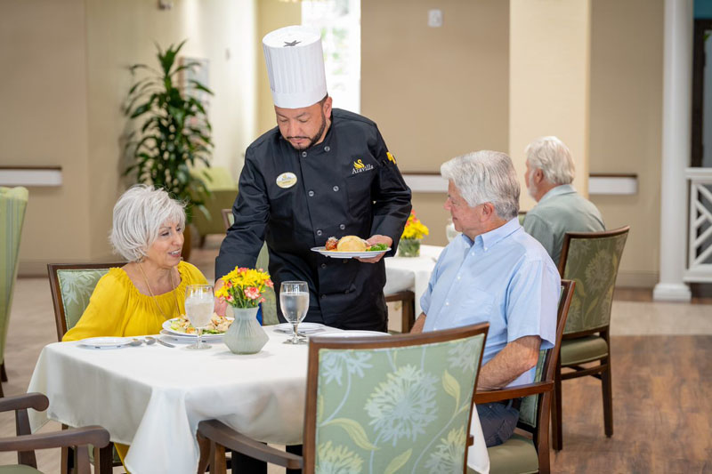 Chef Jose serving Senior Residents at Aravilla Clearwater Memory Care