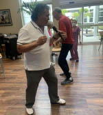 Louie - residents dancing at Aravilla Clearwater Memory Care Community