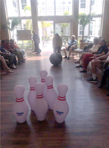 memory care residents bowling at Aravilla Clearwater