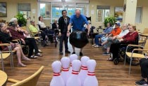 memory care residents bowling at Aravilla Clearwater
