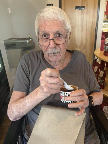 memory care resident enjoying chocolate ice cream