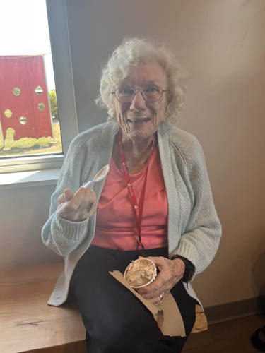 memory care resident enjoying ice cream
