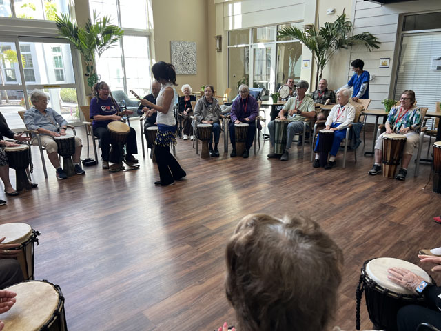 memory care residents drum circle