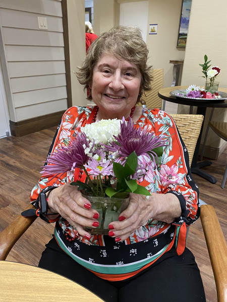 memory care resident Sheila with flower pot