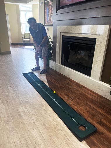 memory care residents playing cornhole