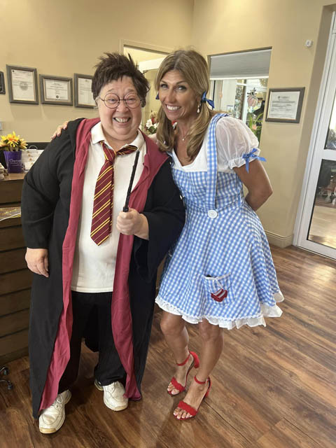 memory care staff dressed up as Harry Potter and Dorothy