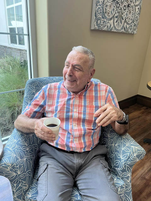 memory care resident Bill having coffee