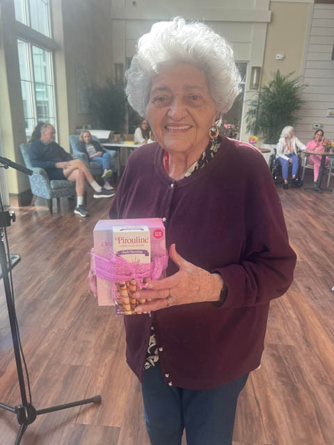 senior memory care resident with her prize