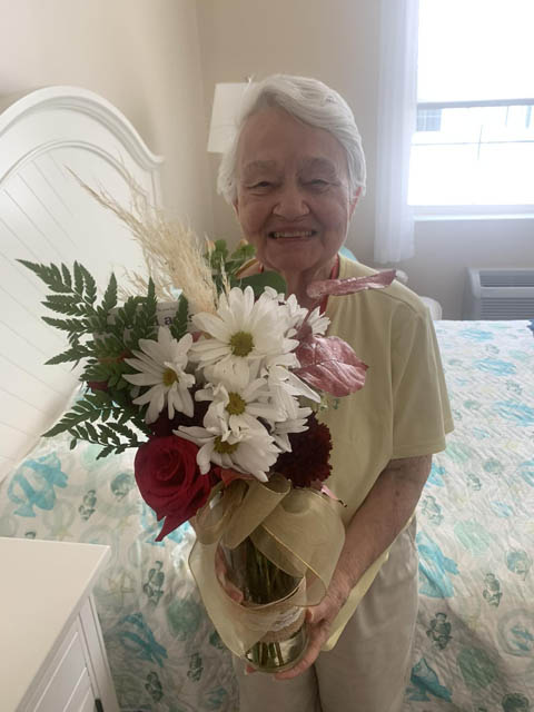 memory care resident with flowers
