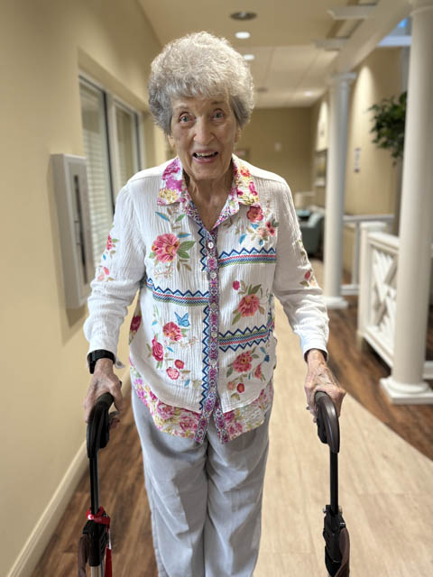 memory care resident keeping active walking