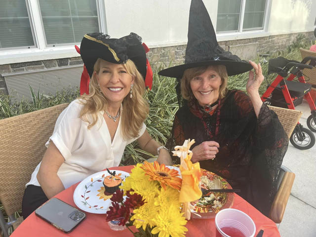 memory care resident and daughter in Halloween costumes