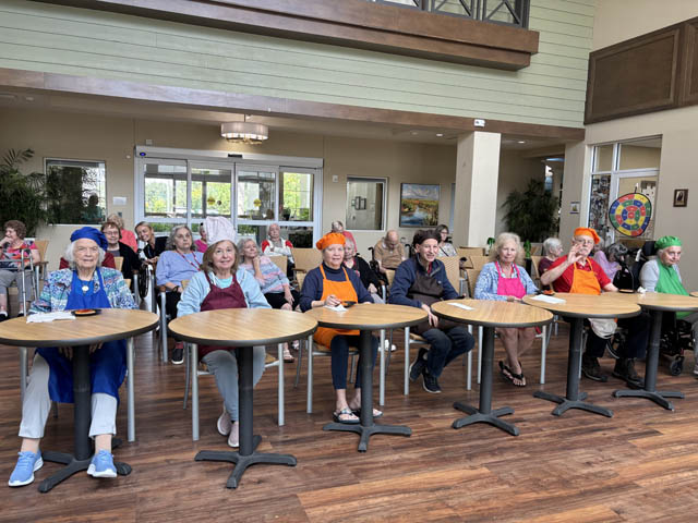 senior residents love cooking senior residents love their cooking class at Aravilla Clearwater