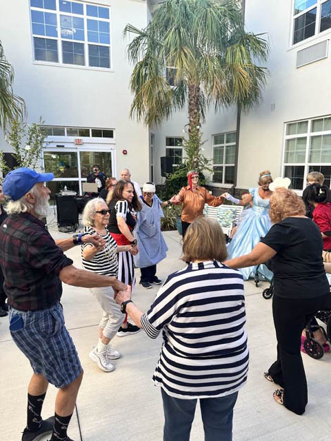 memory care residents enjoying the fall festival