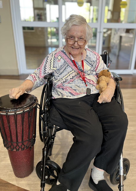 senior resident with drum
