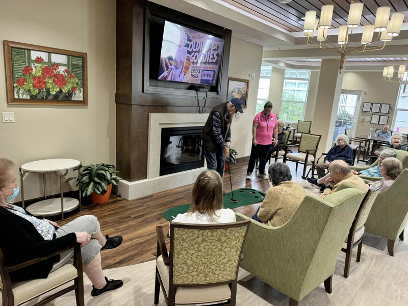 memory care residents playing golf memory care residents playing golf