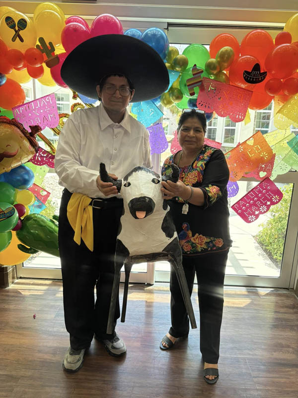 senior residents enjoying Cinco de Mayo performances